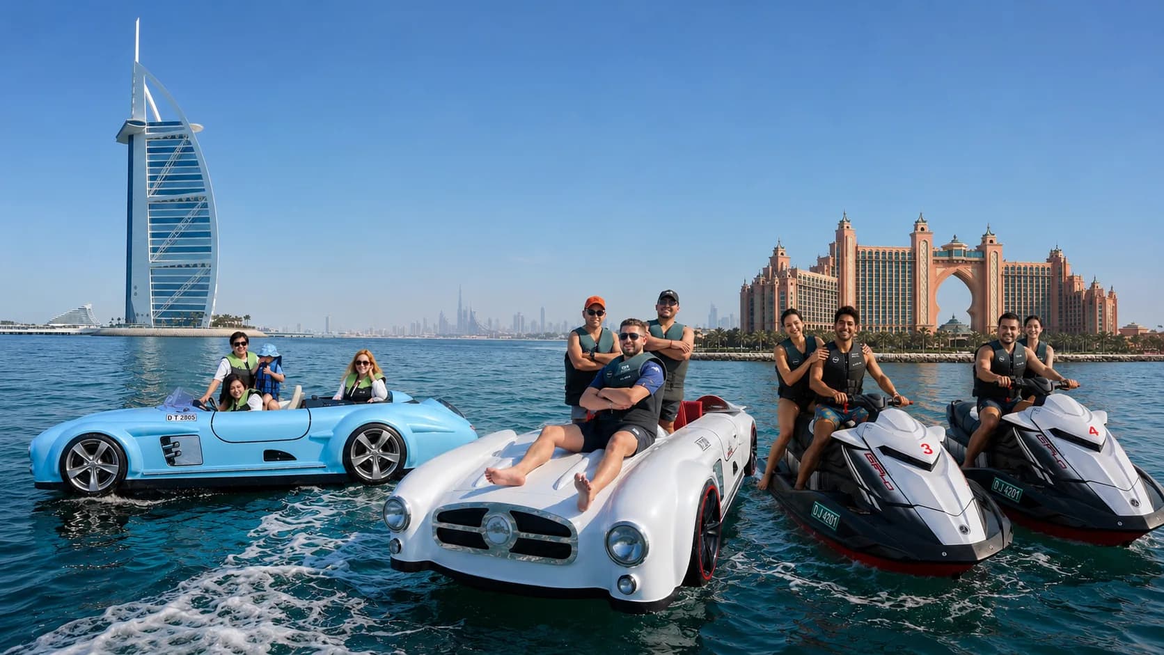 Oceans Kings jet cars and jet skis on the water in front of the Burj Al Arab and Atlantis The Palm in Dubai